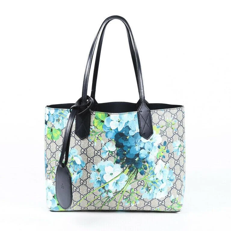 Minimalist leather handbagsGucci Small Blooms GG Supreme Reversible Tote