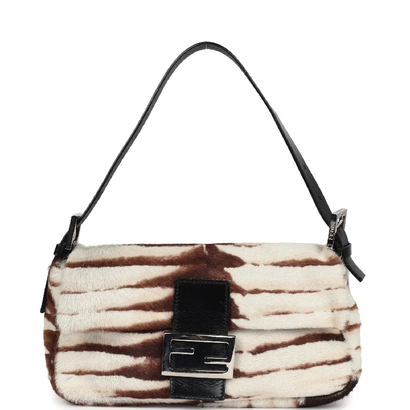 Fendi Baguette bags with a studded leather trim for a bold and edgy lookVintage Fendi Baguette Bag Brown and White Pony Hair Silver Hardware