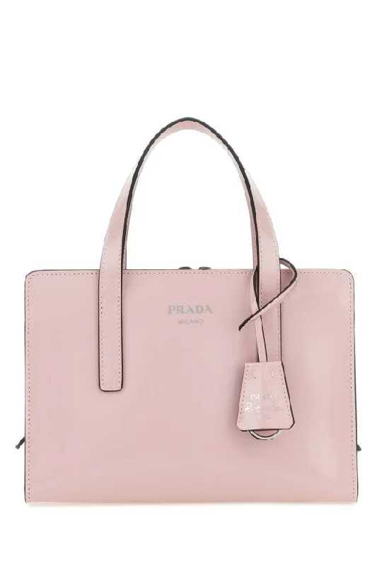 Prada handbags with a perforated leather detail for a unique and breathable designPrada Women Pastel Pink Leather Re-Edition 1995 Handbag