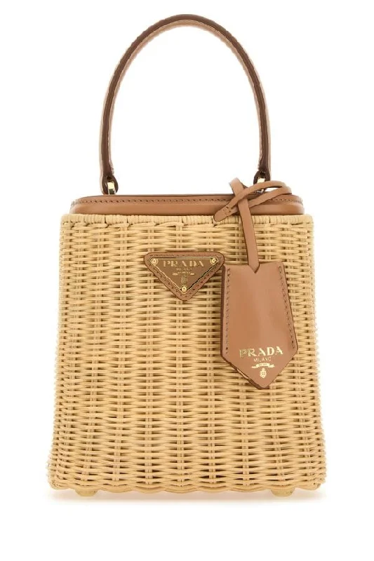 Prada tote bags with a water - resistant coating for outdoor activitiesPrada Women Two-Tone Wicker And Leather Bucket Bag