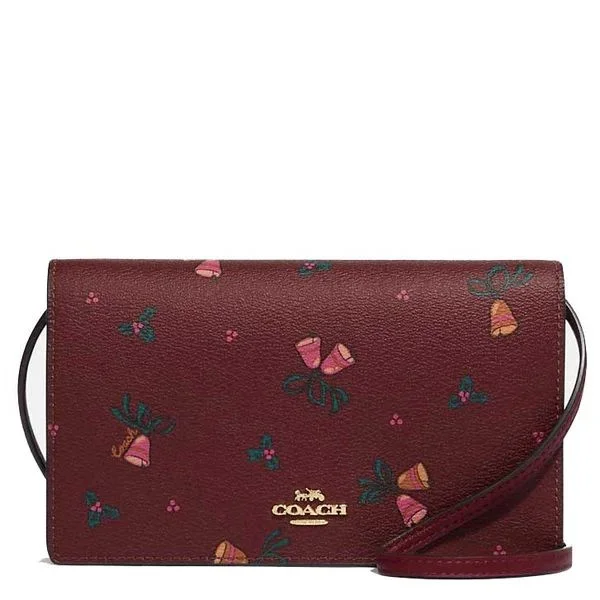 Affordable designer bag dupesCoach Anna Foldover Clutch Crossbody With Holiday Bells Print