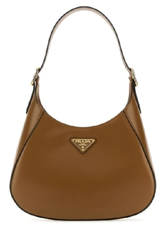 Prada Cahier bags with a monogram - embossed leather surfacePrada Women Biscuit Leather Cleo Shoulder Bag