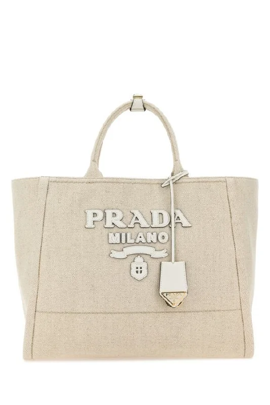 Prada tote bags with a spacious interior and a magnetic - snap closurePrada Women Sand Canvas Shopping Bag