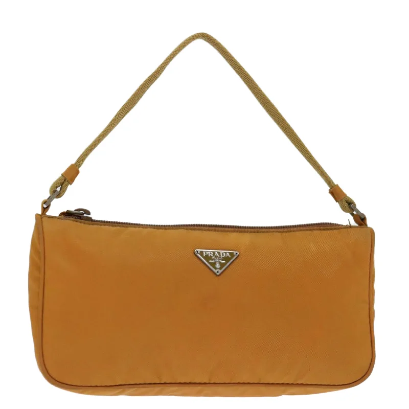 Prada Cleo bags with a contrast - colored interior for visual interestPRADA Accessory Pouch Nylon Orange Auth bs12557